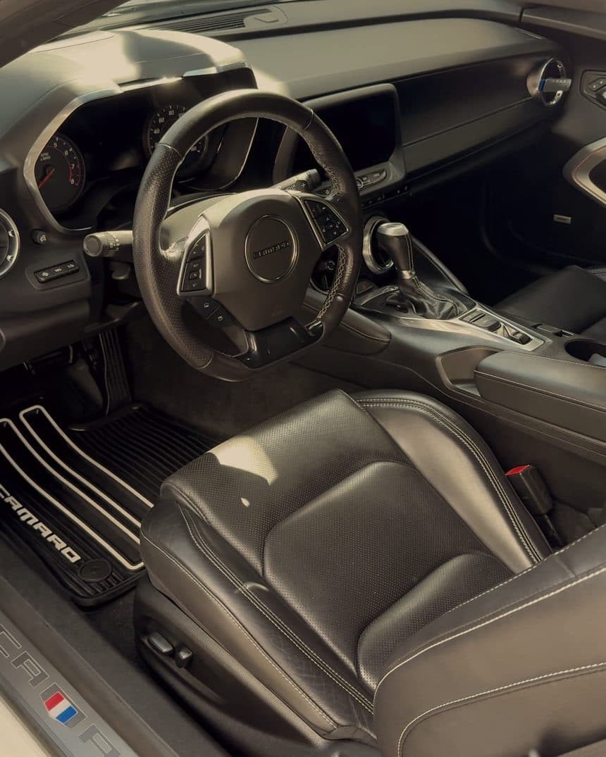 Front cabin of a Chevrolet Camaro with black leather seats