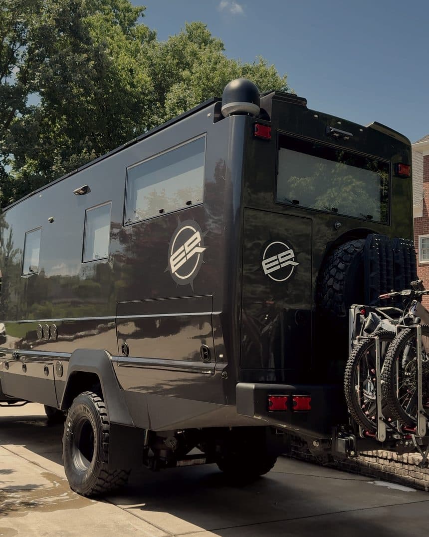 Rear of a black expedition truck on a driveway