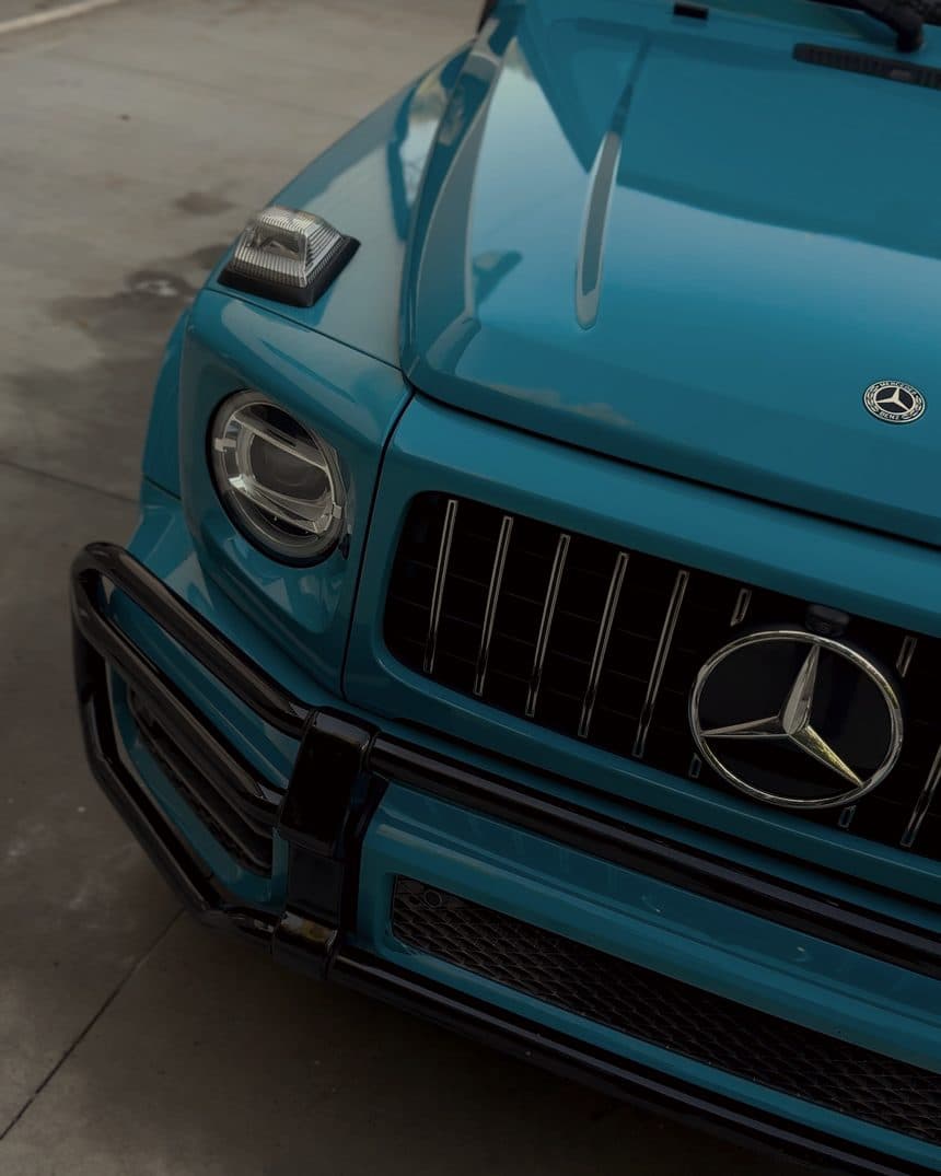 Grille and headlights of a china blue Mercedes G63