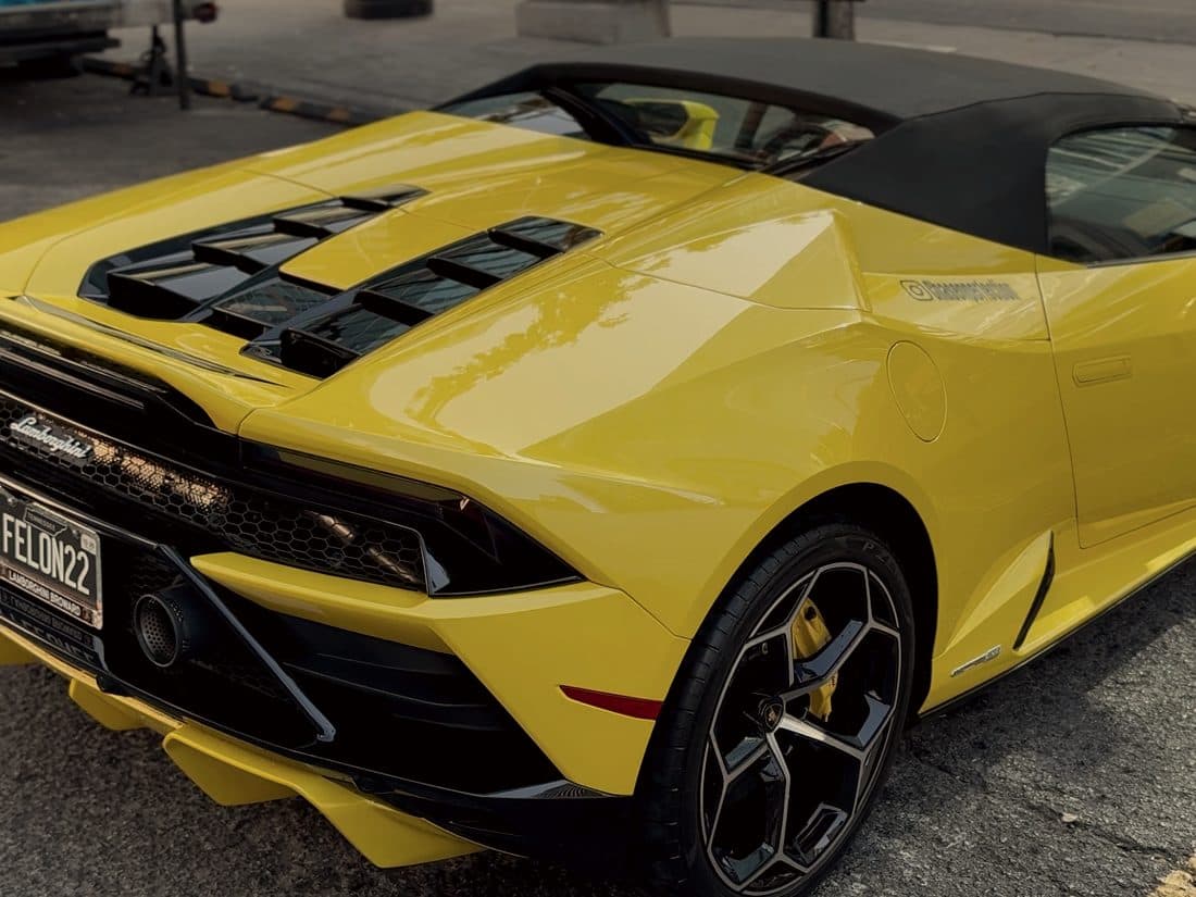 Yellow Lamborghini Huracan parked on a downtown Nashville street