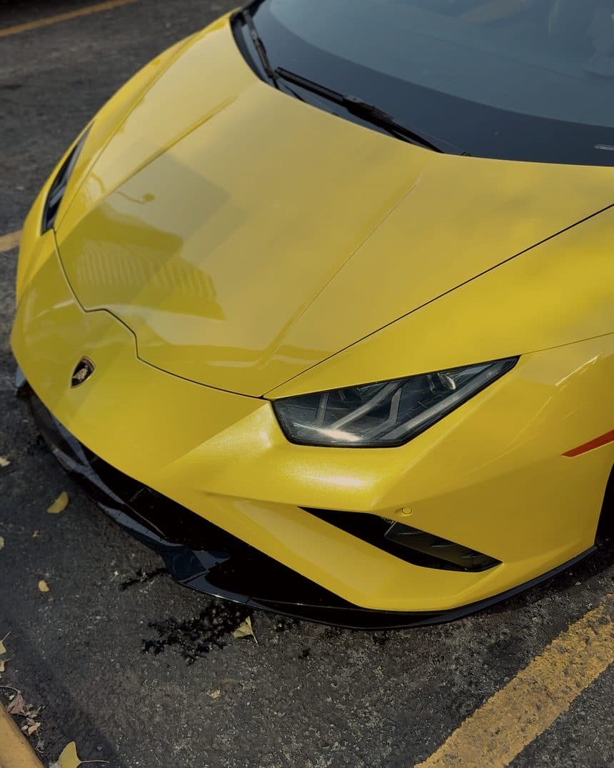 Front clip of a yellow Lamborghini Huracan
