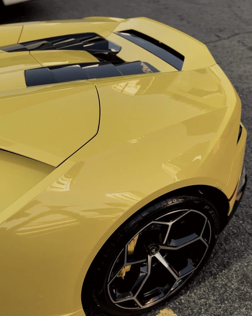 Front quarter and wheel of a yellow Lamborghini