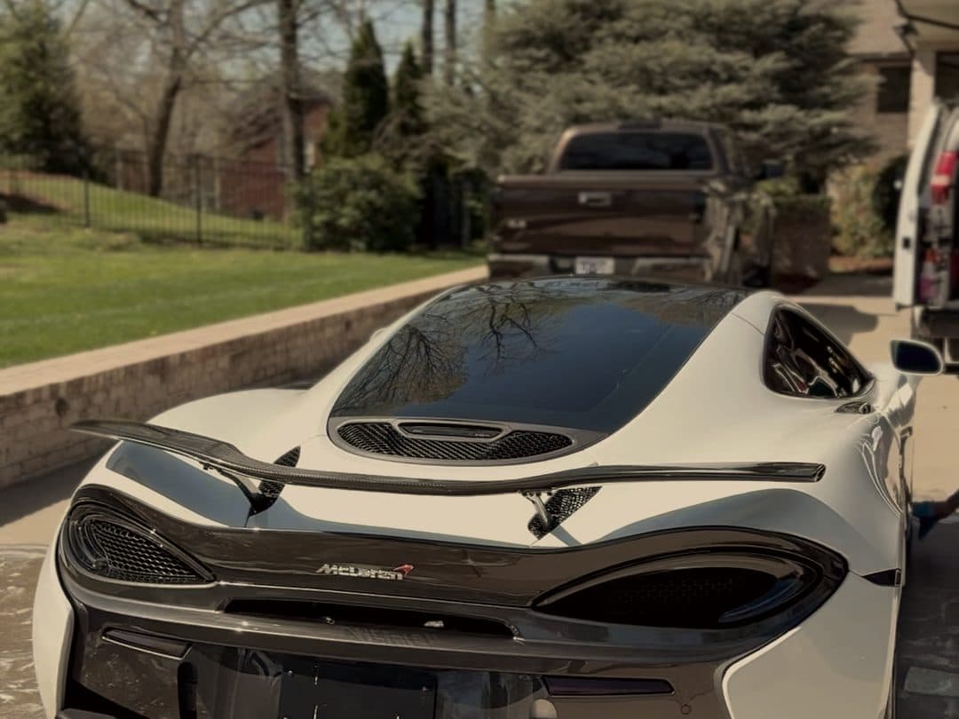 Rear wing and diffuser of a white McLaren 570S