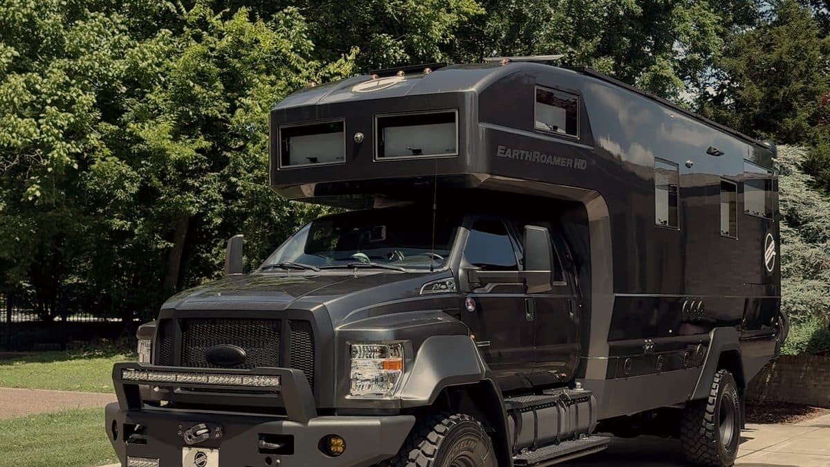 Black expedition truck parked on a driveway