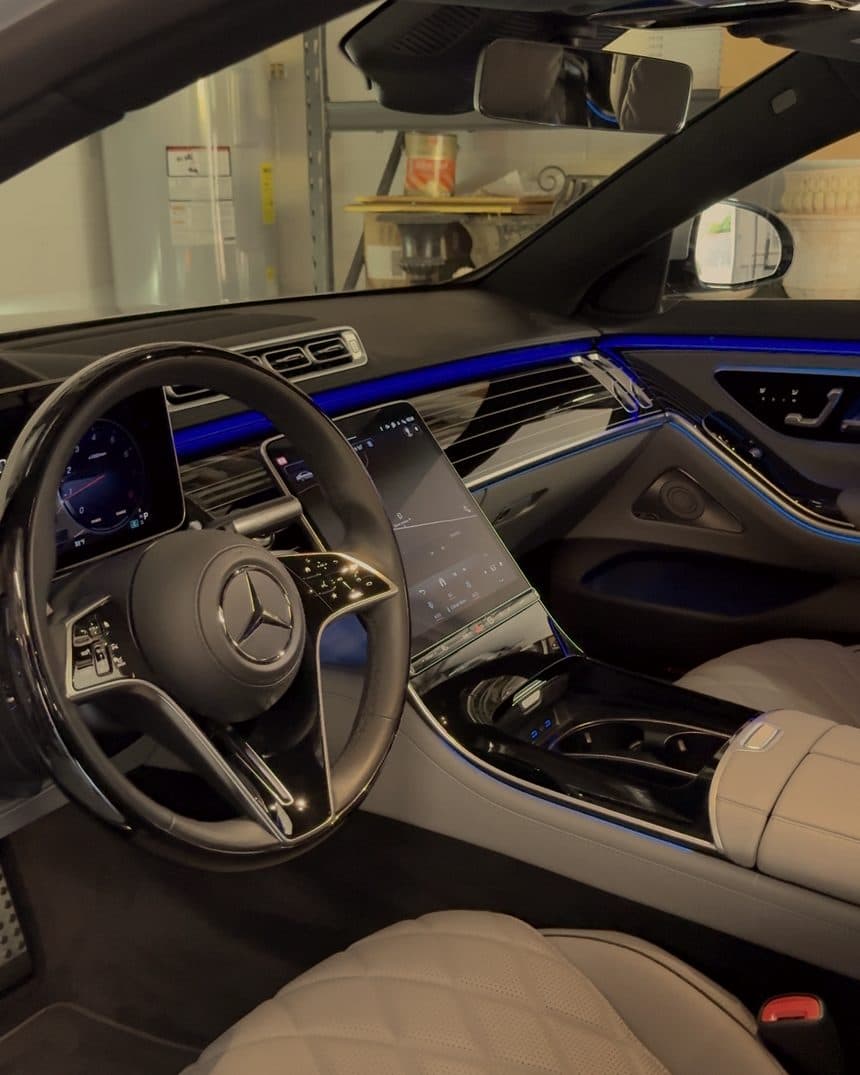 Front cabin of a Mercedes S-Class with cream quilted leather seats
