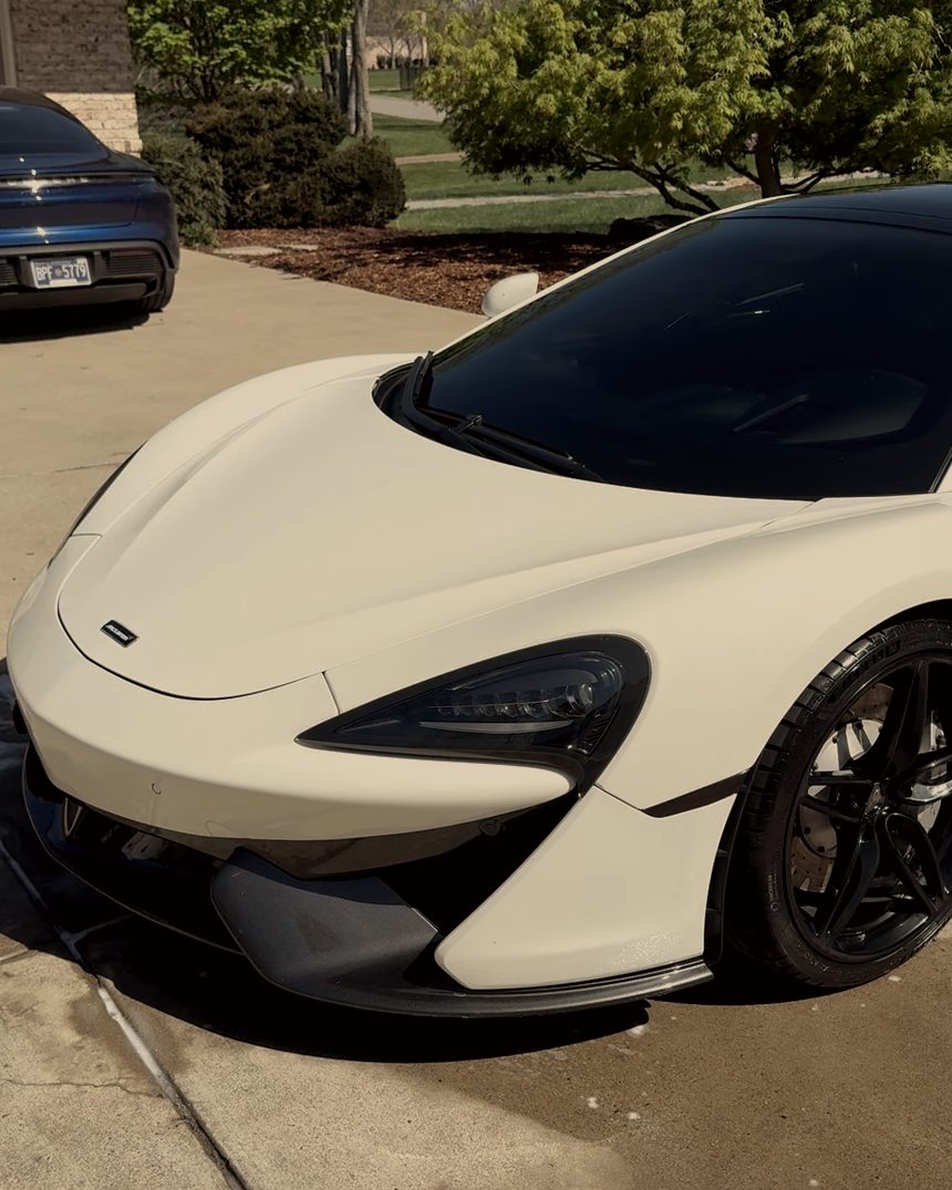 White McLaren 570S parked on a driveway